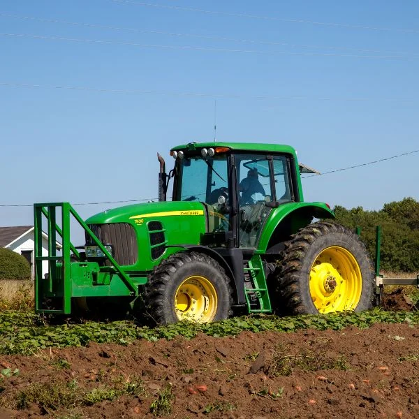 Farming Equipment Repair 2 Green tractor in a field