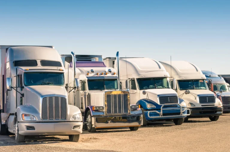 Big rig and semi trucks parked in a row