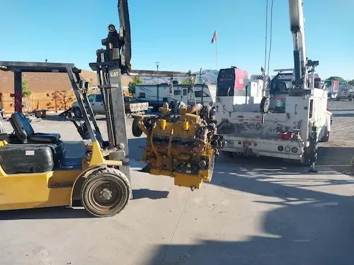 Horizon Equipment Repair pulling engine with a fork lift and crane truck