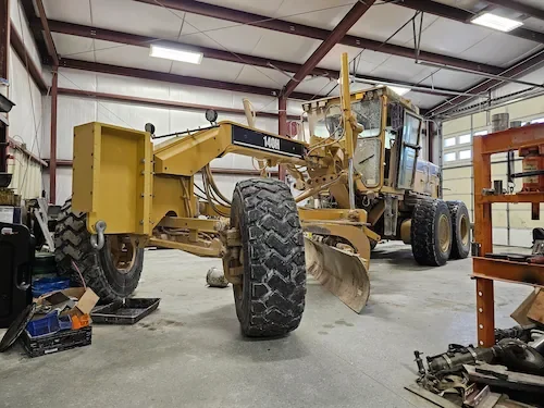 Grader repair inside Horizon Equipment Repair Shop